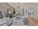 Open living room with hardwood floors, fireplace, and seamless flow to the kitchen at 18423 Lithia Towne Rd, Lithia, FL 33547
