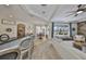 Open-concept floor plan with a kitchen, dining area, living room with a stone accent wall at 18423 Lithia Towne Rd, Lithia, FL 33547