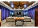 A beautiful living room boasting a coffered wood ceiling, a ceiling fan, recessed lights and plush furniture at 18423 Lithia Towne Rd, Lithia, FL 33547