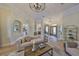 Bright living room with elegant furniture, hardwood floors, and easy access to other rooms at 18423 Lithia Towne Rd, Lithia, FL 33547