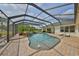 Screened in pool with waterfall feature, beautiful landscaping and plenty of room for entertaining at 18423 Lithia Towne Rd, Lithia, FL 33547