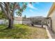 Expansive backyard with screened-in pool and lush landscaping, creating a serene outdoor oasis at 1916 Sandstone Pl, Clearwater, FL 33760