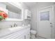Bathroom featuring a vanity with granite counters, toilet, and walk-in shower at 1916 Sandstone Pl, Clearwater, FL 33760
