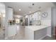Modern kitchen featuring white countertops and cabinetry, with tile flooring and stainless steel appliances at 1916 Sandstone Pl, Clearwater, FL 33760