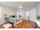 Serene primary bedroom with hardwood floors, ceiling fan, and ensuite bathroom access at 1916 Sandstone Pl, Clearwater, FL 33760