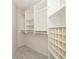 Organized walk-in closet with shelves and rack at 1916 Sandstone Pl, Clearwater, FL 33760
