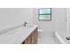 Clean bathroom featuring a marble countertop and contemporary fixtures for an updated look at 2003 E Clinton St, Tampa, FL 33610