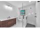 Modern bathroom features a glass-enclosed shower and a stylish vanity with ample counter space at 2003 E Clinton St, Tampa, FL 33610