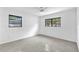 Bright bedroom featuring dual windows that offer exterior views and natural light at 2003 E Clinton St, Tampa, FL 33610