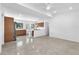 Open kitchen featuring stainless steel appliances, bar seating, wood cabinets, and recessed lighting at 2003 E Clinton St, Tampa, FL 33610