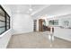 Open-concept living room and kitchen with lots of natural light and recessed lighting at 2003 E Clinton St, Tampa, FL 33610