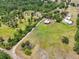 Wonderful aerial view of land with home and barn with location marker at 21019 Lonesome Acre Rd, Wimauma, FL 33598