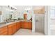 Bright bathroom with double sinks, tile floors, and a glass enclosed shower at 21019 Lonesome Acre Rd, Wimauma, FL 33598