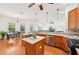 Spacious kitchen featuring granite countertops, stainless steel appliances, and a kitchen island at 21019 Lonesome Acre Rd, Wimauma, FL 33598