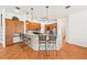 Spacious kitchen with granite countertops, a kitchen island and seating and wood cabinetry at 21019 Lonesome Acre Rd, Wimauma, FL 33598