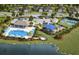 Aerial view of community amenities including a pool, playground, and basketball court at 2541 Charter Oak Dr, North Port, FL 34289