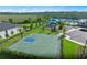 Nice aerial view of the community basketball court near the parking lot and playground at 2541 Charter Oak Dr, North Port, FL 34289