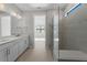 Beautiful bathroom featuring double vanity, walk-in shower, and tile flooring at 2541 Charter Oak Dr, North Port, FL 34289