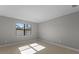 Cozy bedroom with neutral walls, a window, and tile flooring at 2541 Charter Oak Dr, North Port, FL 34289