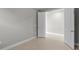 Neutral hallway featuring tile flooring and a bright white door at 2541 Charter Oak Dr, North Port, FL 34289