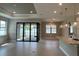 Bright open-concept living space featuring tile floors and sliding glass doors at 2541 Charter Oak Dr, North Port, FL 34289