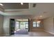 Bright, airy living room featuring large sliding doors to the lanai and elegant lighting fixtures at 2541 Charter Oak Dr, North Port, FL 34289