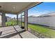 The screened patio features tiled flooring with views of the backyard and fence at 2541 Charter Oak Dr, North Port, FL 34289