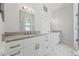 Sleek bathroom with double vanities, elegant lighting, and a glass-enclosed shower providing a modern spa experience at 2810 N Jefferson St, Tampa, FL 33602