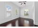 This bedroom offers dark wood floors, many windows, and neutral walls at 2810 N Jefferson St, Tampa, FL 33602