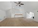 Carpeted bonus room with a vaulted ceiling, ceiling fan and staircase at 2810 N Jefferson St, Tampa, FL 33602