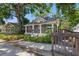 Charming home with inviting front porch, well-maintained landscaping, and classic architectural details, offering great curb appeal at 2810 N Jefferson St, Tampa, FL 33602