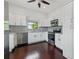 Modern kitchen featuring white cabinets, stainless steel appliances, and elegant granite countertops at 2810 N Jefferson St, Tampa, FL 33602