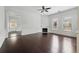 Elegant living room with wainscoting, dark hardwood floors, and a decorative fireplace, showcasing the home's character at 2810 N Jefferson St, Tampa, FL 33602