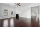Spacious living area with rich hardwood floors, decorative fireplace, and classic architectural details at 2810 N Jefferson St, Tampa, FL 33602