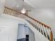 Staircase with white risers and wood handrail leads to the second story at 2810 N Jefferson St, Tampa, FL 33602