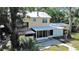 Back of house featuring a balcony, screened in porch, and backyard at 315 Wooten Rd, Lutz, FL 33548