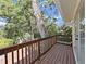Private balcony with wood flooring and railings, offering scenic outdoor views at 315 Wooten Rd, Lutz, FL 33548