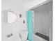 This bathroom features a walk-in shower, toilet, and sink with a vanity and decorative mirror at 315 Wooten Rd, Lutz, FL 33548