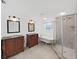Elegant bathroom with dual vanities, freestanding tub, and glass shower at 315 Wooten Rd, Lutz, FL 33548