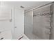 Bright bathroom featuring a modern shower with sleek tile and glass door at 315 Wooten Rd, Lutz, FL 33548