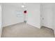 Bright bedroom featuring neutral carpet, window, and closet at 315 Wooten Rd, Lutz, FL 33548