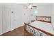 Bright bedroom features wood floors, a ceiling fan, and a wooden bed frame at 315 Wooten Rd, Lutz, FL 33548