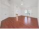 Large bedroom with hardwood floors, ensuite bathroom and balcony access at 315 Wooten Rd, Lutz, FL 33548