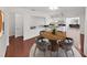 Cozy dining room with hardwood floors and an open design flowing into the bright, renovated kitchen at 315 Wooten Rd, Lutz, FL 33548