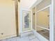 Exterior view of a door leading to an enclosed porch with screens at 315 Wooten Rd, Lutz, FL 33548