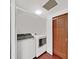 This laundry room features a modern washer and dryer with easy access to a storage closet at 315 Wooten Rd, Lutz, FL 33548