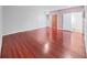 Spacious living room featuring hardwood floors and natural light, perfect for entertaining at 315 Wooten Rd, Lutz, FL 33548