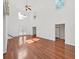 Large living room with vaulted ceilings, hardwood floors, and lots of natural light at 315 Wooten Rd, Lutz, FL 33548