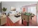 Comfortable living room with hardwood floors, a foosball table, and calming decor at 315 Wooten Rd, Lutz, FL 33548