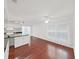 Bright living room featuring hardwood floors, a ceiling fan, and natural light from the window at 315 Wooten Rd, Lutz, FL 33548